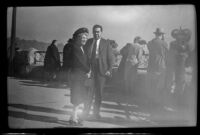 Mertie West and Mr. Stewart stand on a viewing platform, Niagara Falls, 1947