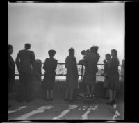Mertie West and other sightseers stand at a viewpoint overlooking Niagara Falls, Niagara Falls, 1947
