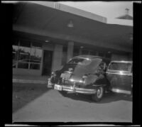 Car parked at the checking and customs station on entering Canada, Niagara Falls, 1947
