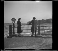 Mertie West and H. H. West stand on an observation deck overlooking the American Falls, Niagara Falls, 1947