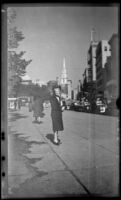 Mertie West stands on a sidewalk outside Boston Common, Boston, 1947