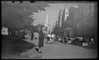 Mertie West stands on a sidewalk at Boston Common, Boston, 1947