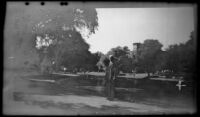 H. H. West stands beside the frog pond in Boston Common, Boston, 1947