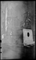 Mertie West poses next to the John Harvard statue in Harvard Yard, Cambridge, 1947