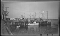Fishing boat moored to the wharf, Plymouth, 1947