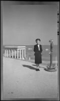 Mertie West poses on a walkway at Cole's Hill overlooking Plymouth Rock, Plymouth, 1947