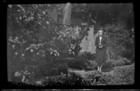 Mertie West poses in Old North Memorial Garden, Boston, 1947