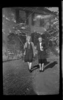 Mertie West and caretaker stand outside Buckman Tavern, Lexington, 1947