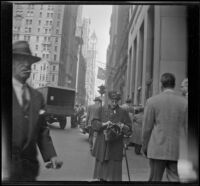Pedestrians stroll down Broadway, New York, 1947