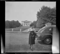Mertie West crosses a driveway in Arlington National Cemetery, Arlington, 1947