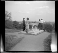 Sightseers visiting the gravesite of Pierre Charles L'Enfant gaze towards Washington, D.C., Arlington, 1947
