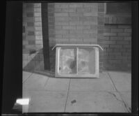 Aluminum window posed on the sidewalk, Los Angeles, 1948