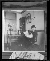 Harry Hershey Cooper sits at a desk in the first Southern Pacific Railroad telegraph office on Sixth and Main, Los Angeles, about 1902