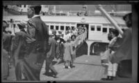 Visitors disembark from a ship upon arrival in Avalon, Avalon, 1948