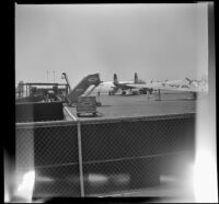 Will Witherby waves to camera before boarding his plane to Chicago at Los Angeles Airport, Los Angeles, 1948