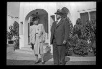 Josie Shaw and Will Shaw stand in front of the West residence, Los Angeles, 1948
