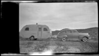 Main Line Silver Lark trailer parked in a desert landscape during a trip from Los Angeles to Mexico, 1948