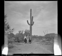 Agnes Whitaker, Forrest Whitaker and Mertie West in front of a cactus during a trip to Mexico, 1948