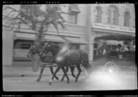 Horse-drawn surrey carriage on Main Street at Disneyland, Anaheim, 1957
