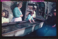 Anna West with her daughter Debbie West who is panning for gold at Knott's Berry Farm, Buena Park, 1957