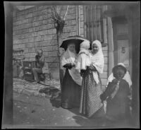Turkish women and children in front of a building, Turkey, 1895