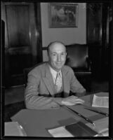 Virgil Dew in the office of Joe Crail, California, 1936