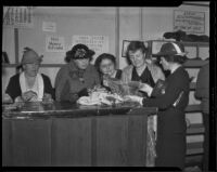 Mrs. George P. Griffith, Kate Page Crutcher, Mabel Frankenfield, Florence O. Hunt, and Mrs. H.G. Raymond at the Children's Hospital Salvage Shop, Los Angeles, 1936