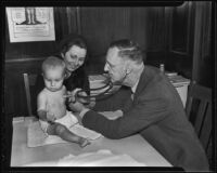 Dr. Cory Ledyard inspects Tommy Headland (7 mos.) with mother Margaret Headland at the Mothers' Educational Center, Los Angeles, 1936