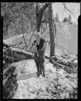 Grace Davies and her dogs enjoy the snow, Lake Arrowhead, 1936