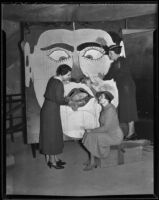 Mmes. Hal Ashley, Arthur Shafer, and William Dickenson prepare for the John Burroughs Junior High School carnival, Los Angeles, 1936