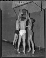 Gordon Dodge, Ed Lynch, and Bob Nuenbel play basketball, Chino, 1935-1936