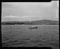 Boat patrols the waters for illegal activity, Newport Beach, 1935