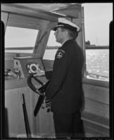 Captain Edward Hyde steers the Braodbill, Newport Beach, 1935