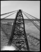 A crane digging in the sand, Calexico, 1936