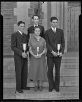 Leonard Hilborne, Leonard Hoffman, Rosamond Coyner, and Douglas Badt hold their awards in front of Los Angeles High School from the Mayflower Society's second annual oratorical contest, Los Angeles, 1936