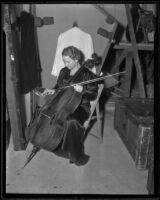 Cellist Elsa Hilger sits backstage with her cello, Los Angeles, 1936