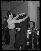 Saul Caston hangs up his concert jacket, Los Angeles, 1936