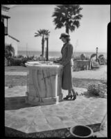 Elizabeth Case checks the time on a sundial, Ensenada, 1936
