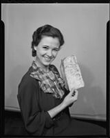 Evelyn Porter with air mail letter from wrecked plane, Los Angeles, 1936