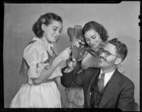 Mayor Flynn's facial hair is under attack by sisters Rosanna and Leanna Grossnickle, San Fernando, 1936