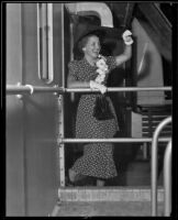 Eleanor Mae Rosetti waves farewell from a ship, Southern California, 1936
