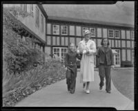 Nancy Schmoele with daughters Nancy and Joane take a morning stroll outside Lake Arrowhead lodge, Lake Arrowhead, 1936