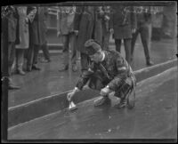 Medinah Shriners patrol unit pretending to boat on a rainy street, Los Angeles, 1936