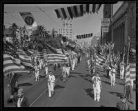 Color bearers parade down Hollywood Boulevard during the American Legion convention, Los Angeles, 1936