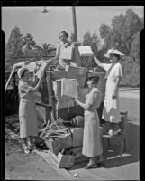 Stella S. Codd, Hermine Rubel, Carolyn M. Sichel, and Elaine H. Englehart, members of the Council of Jewish Women loading a truck for the Council Thrift Shop, Los Angeles, 1936