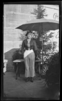 Joseph (Joe) V. Smith posing in blouse, trousers, beret, heeled boots, Los Angeles, 1936