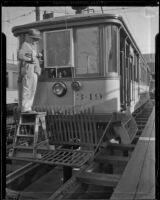 Metal screens placed on street car windows to protect motormen during L. A. Railway strike, Los Angeles, 1934