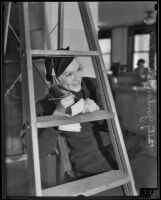 Betty Gordon with the will of Hermann H. Strathmann, written on a ladder, Los Angeles, 1934