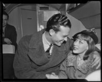 Actor Craig Reynolds and actress and singer Gertrude Niesen in aircraft cabin, 1937