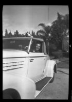 John Wuest Hunt in an automobile, 1925-1935 (?)